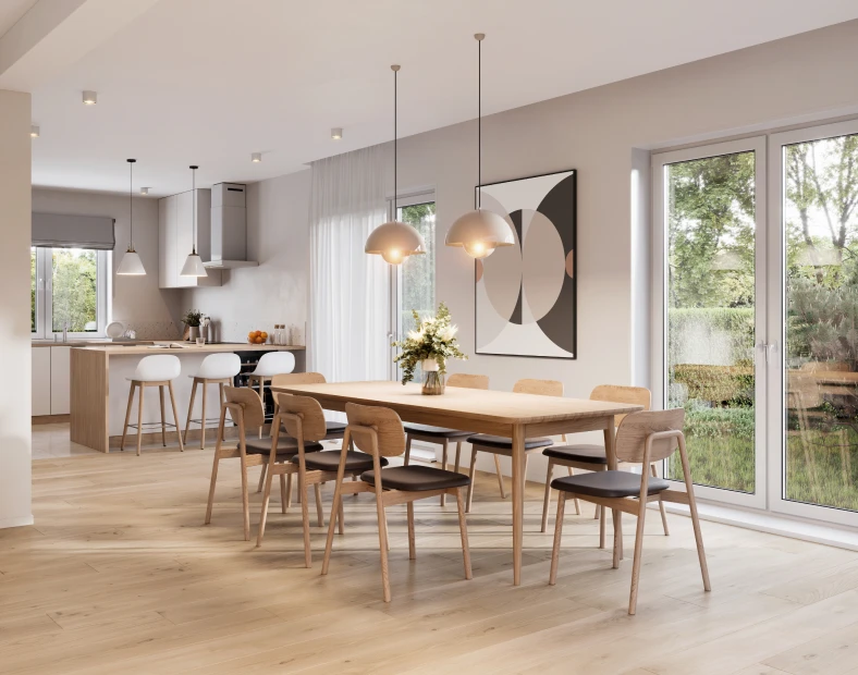 Modern dining and kitchen area with wooden floors, a large dining table for eight, pendant lights, bar stools, and glass doors opening to a garden—perfectly showcasing the style and comfort found in today’s modular homes.